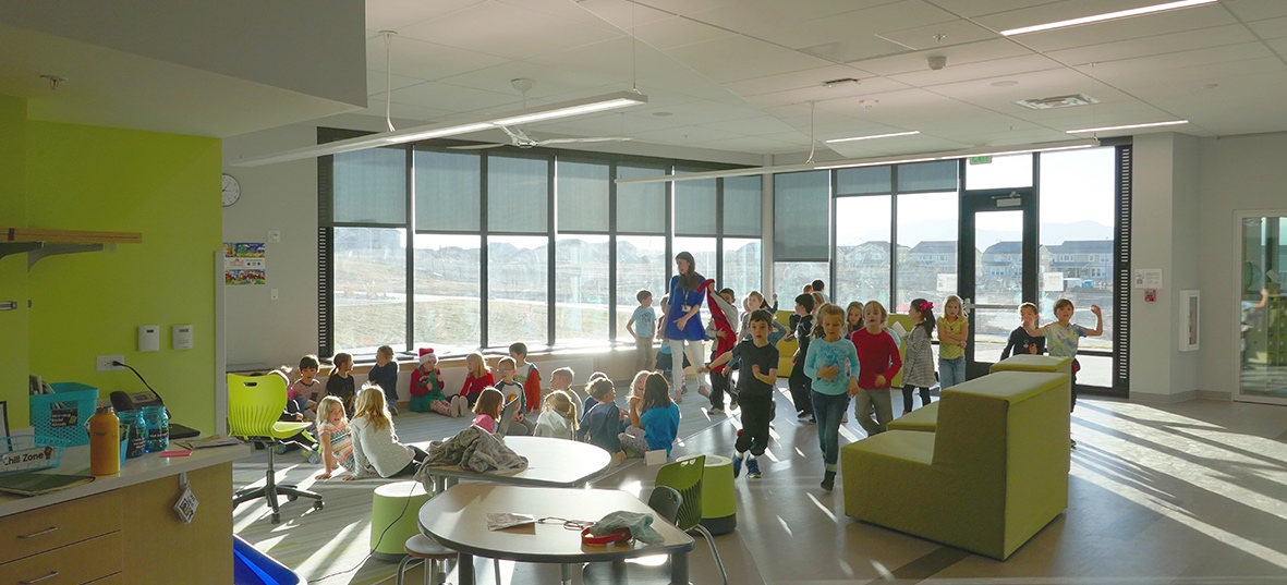 Elementary school floor to ceiling windows inside-out view through external screens