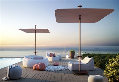 Cream coloured unique soft square style umbrellas on a deck above water