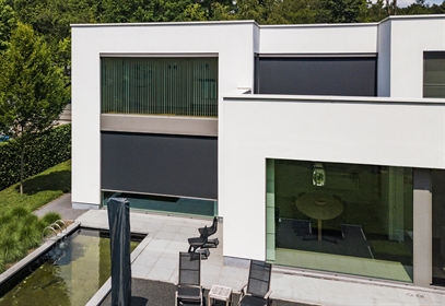 Motorized external blinds on a home for sun protection Motorized external blinds on a home for sun protection